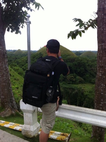 Traveler photographing the Chocolate Hills