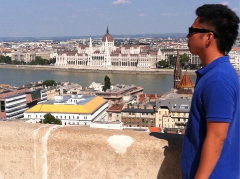 Traveler overlooking the Hungarian Parliament across the Danube