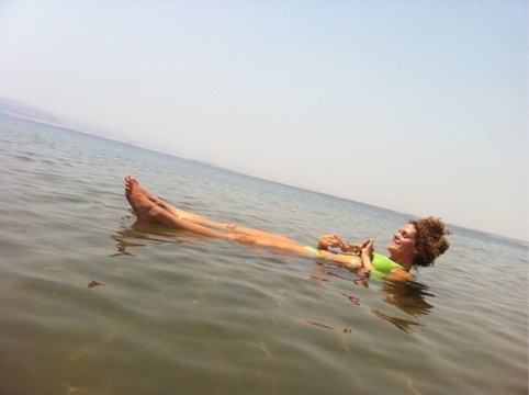 Traveler floating in the Dead Sea