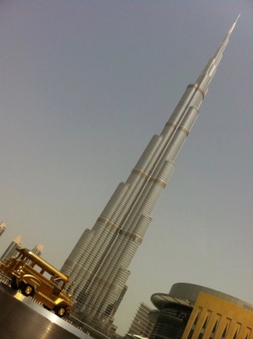 Golden jeepney beneath the Burj Khalifa