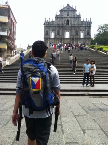 Traveler walking toward the Ruins of St. Paul