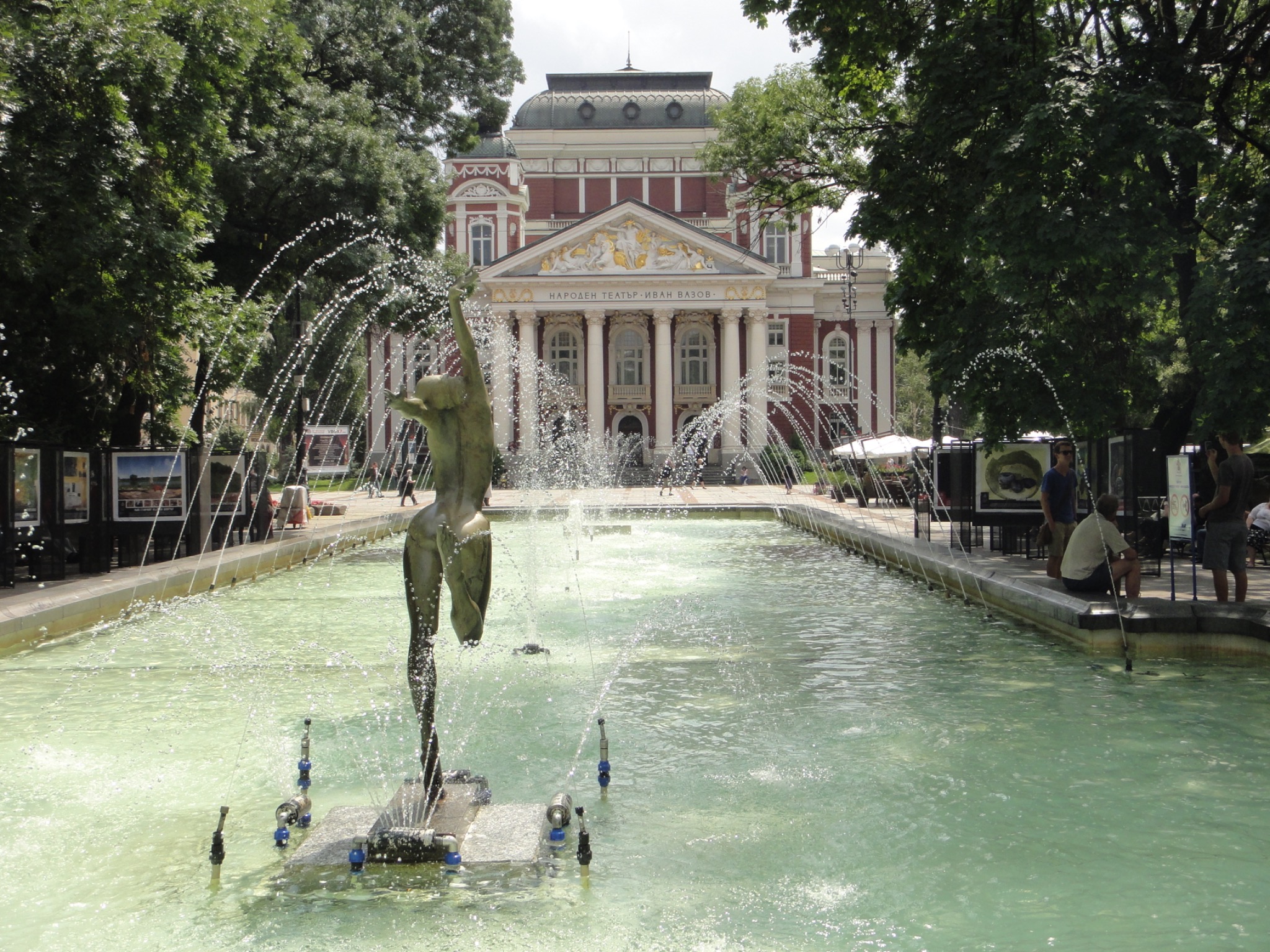Fountain and tree-lined garden before the Ivan Vazov National Theatre in Sofia